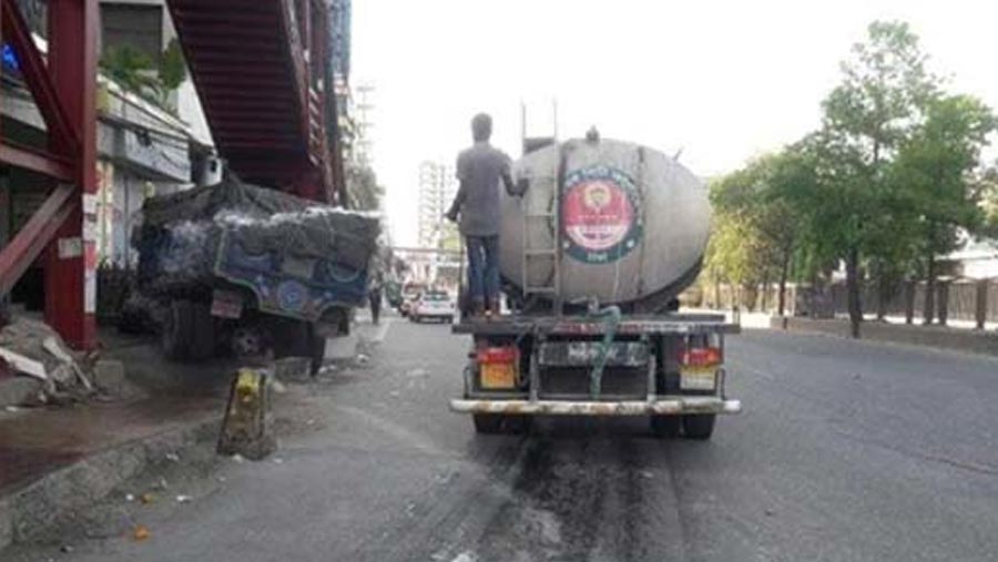 Antiseptic liquid being sprayed in Dhaka