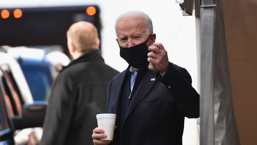 Biden pushes unity before taking over crisis-laden White House