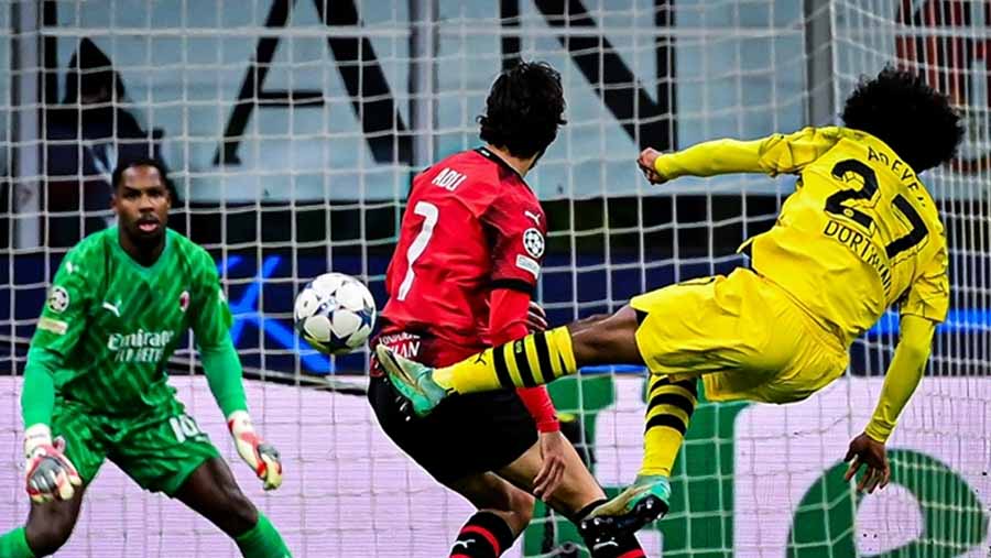 Dortmund reach last 16 with win at Milan